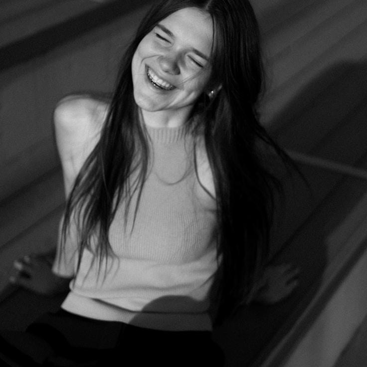 Kaveri Mehta, Lead Design Curator at Lumen Field Press, reviewing corporate floral arrangements